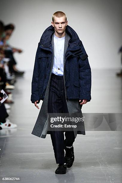 Model walks the runway at the Casely-Hayford show during London Fashion Week Men's January 2017 collections at BFC Show Space on January 7, 2017 in...