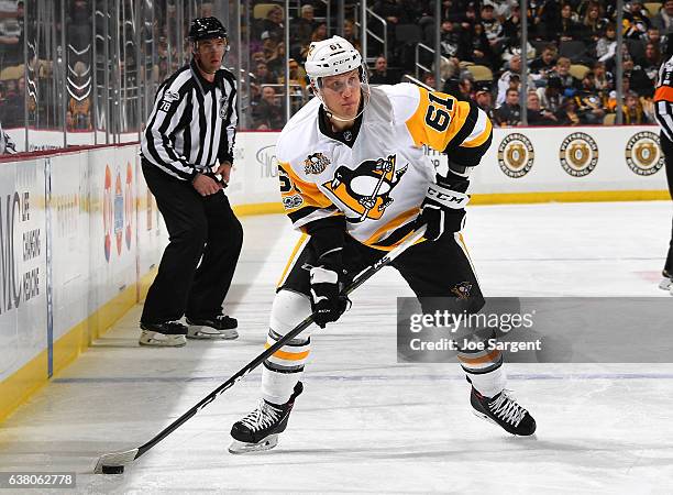 Steve Oleksy of the Pittsburgh Penguins moves the puck against the Tampa Bay Lightning at PPG Paints Arena on January 8, 2017 in Pittsburgh,...