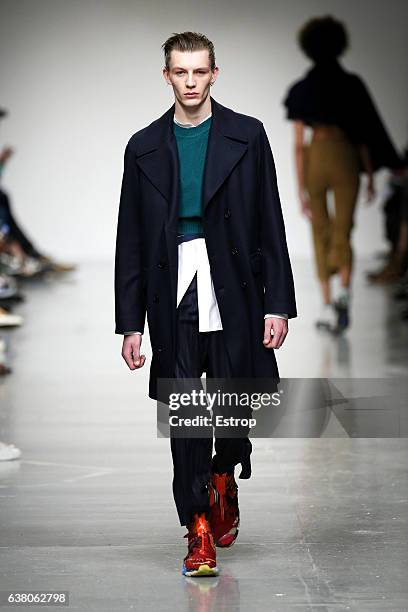 Model walks the runway at the Casely-Hayford show during London Fashion Week Men's January 2017 collections at BFC Show Space on January 7, 2017 in...