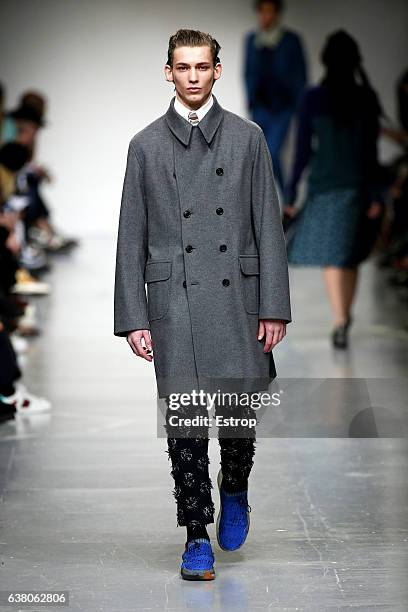 Model walks the runway at the Casely-Hayford show during London Fashion Week Men's January 2017 collections at BFC Show Space on January 7, 2017 in...