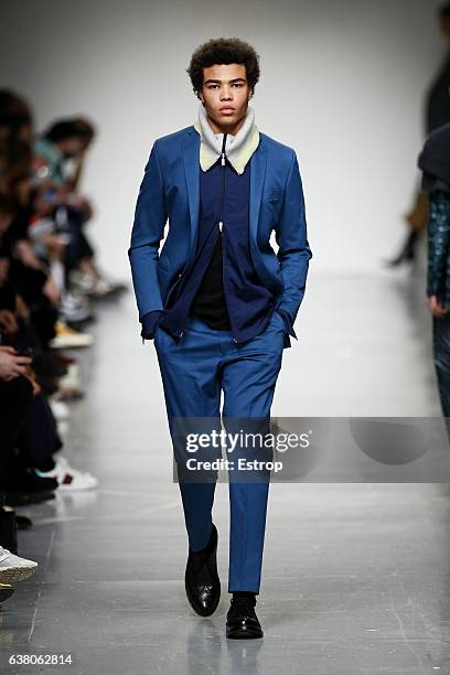 Model walks the runway at the Casely-Hayford show during London Fashion Week Men's January 2017 collections at BFC Show Space on January 7, 2017 in...