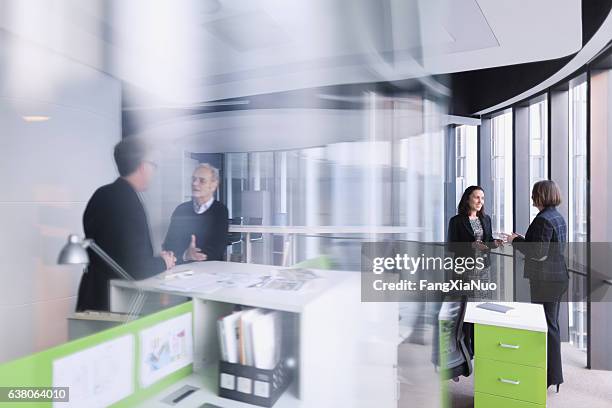 office colleagues talking together in business design agency studio - political meetings stock pictures, royalty-free photos & images