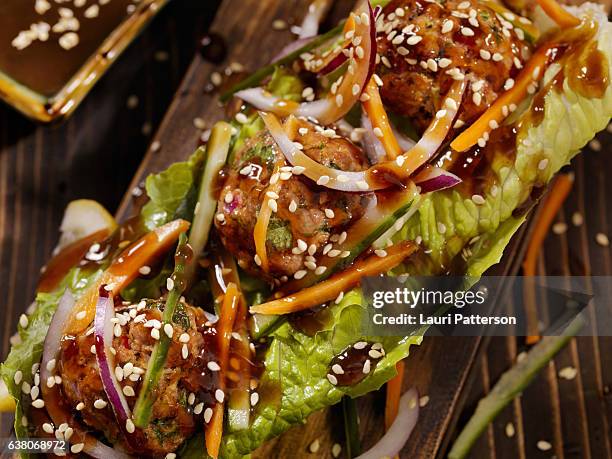 asian inspired meatball lettuce wrap - teriyaki stock pictures, royalty-free photos & images