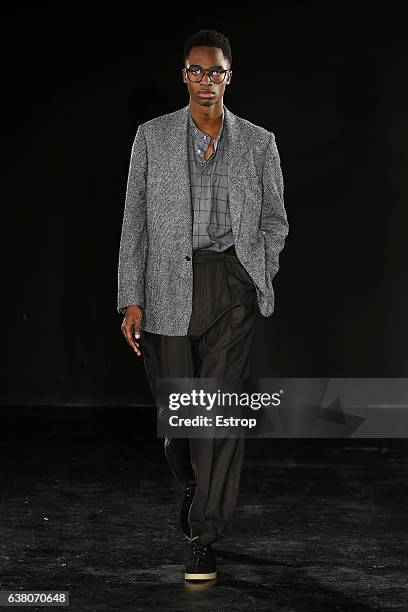 Model walks the runway at the E.Tautz designed by Patrick Grant show during London Fashion Week Men's January 2017 collections at BFC Show Space on...