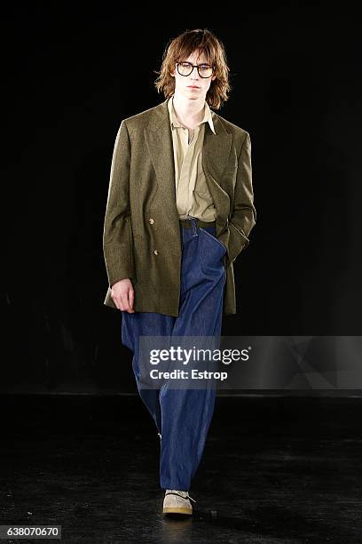 Model walks the runway at the E.Tautz designed by Patrick Grant show during London Fashion Week Men's January 2017 collections at BFC Show Space on...