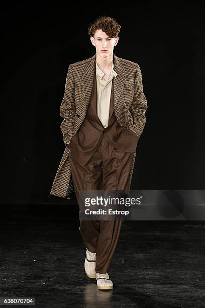 Model walks the runway at the E.Tautz designed by Patrick Grant show during London Fashion Week Men's January 2017 collections at BFC Show Space on...