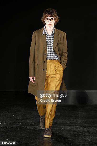 Model walks the runway at the E.Tautz designed by Patrick Grant show during London Fashion Week Men's January 2017 collections at BFC Show Space on...