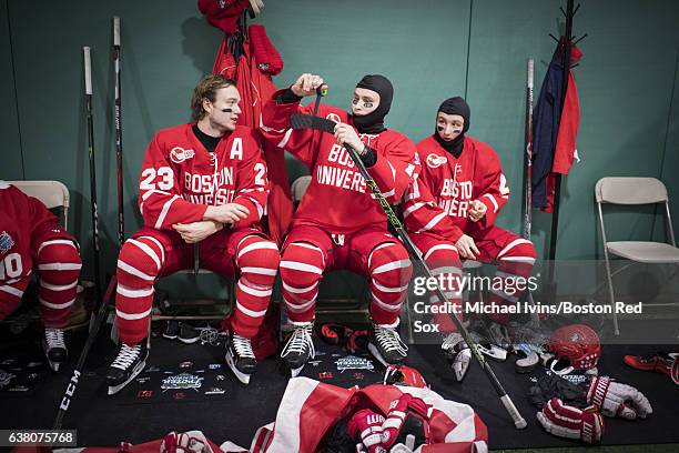 Boston University Terriers Jakob Forsbacka Karlsson, Bobo Carpenter and Patrick Harper prepare before taking the ice against the University of...