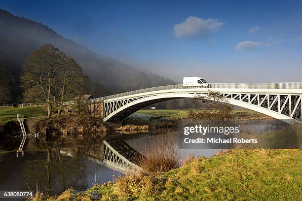 commercial van crossing bigsweir bridge over the river wye near monmouth - furgoneta de reparto fotografías e imágenes de stock