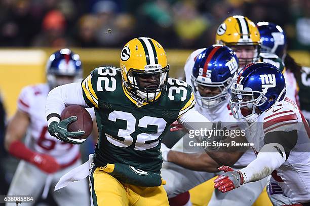 Christine Michael of the Green Bay Packers runs for yards against the New York Giants during the NFC Wild Card game at Lambeau Field on January 8,...