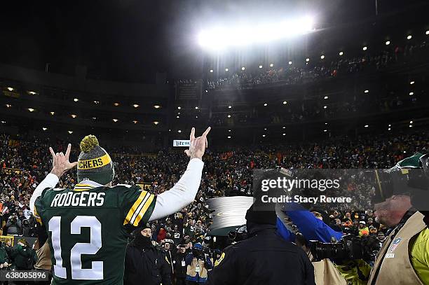 Aaron Rodgers of the Green Bay Packers leaves the field following the NFC Wild Card game against the New York Giants at Lambeau Field on January 8,...