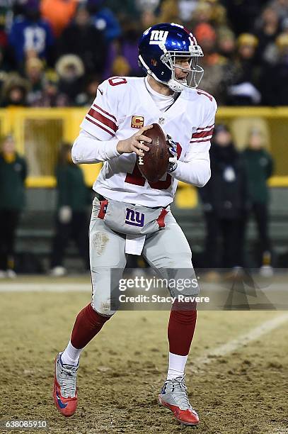 Eli Manning of the New York Giants drops back to pass against the Green Bay Packers during the NFC Wild Card game at Lambeau Field on January 8, 2017...