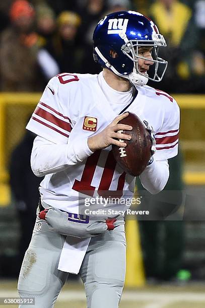 Eli Manning of the New York Giants drops back to pass against the Green Bay Packers during the NFC Wild Card game at Lambeau Field on January 8, 2017...