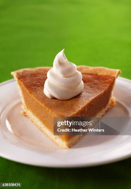 slice of pumpkin pie with dollop of whipped cream - whip cream dollop stock pictures, royalty-free photos & images