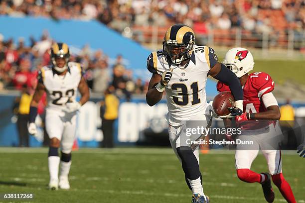 Safety Maurice Alexander of the Los Angeles Rams returns his pass interception against the Arizona Cardinals in the second quarter at Los Angeles...