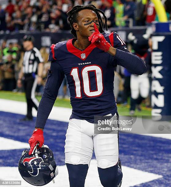 DeAndre Hopkins of the Houston Texans scores against the Oakland Raiders in their AFC Wild Card game at NRG Stadium on January 7, 2017 in Houston,...