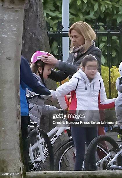 Part of this image has been pixellated to obscure the identity of the child). Princess Cristina of Spain, her daughters Irene Urdangarin and Inaki...