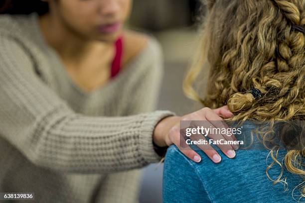 cheering up a friend - consoling stock pictures, royalty-free photos & images