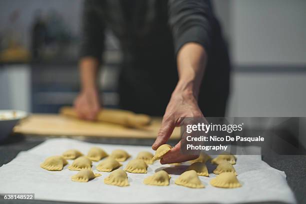 woman making homemade ravioli  - cibo italiano foto e immagini stock