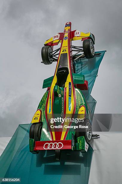 An Audi Formula 1 car is attached to the side of a booth at the annual Consumer Electronics Show on January 4, 2017 in Las Vegas, Nevada. Nearly...