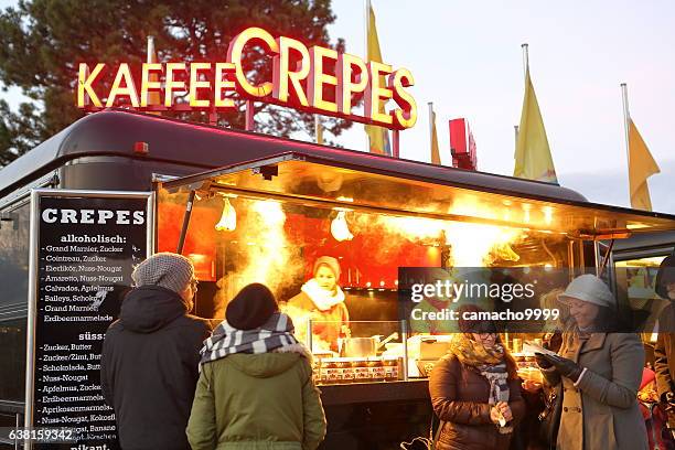 buying hot drinks and food for cold temperatures in germany - olympiapark stock pictures, royalty-free photos & images