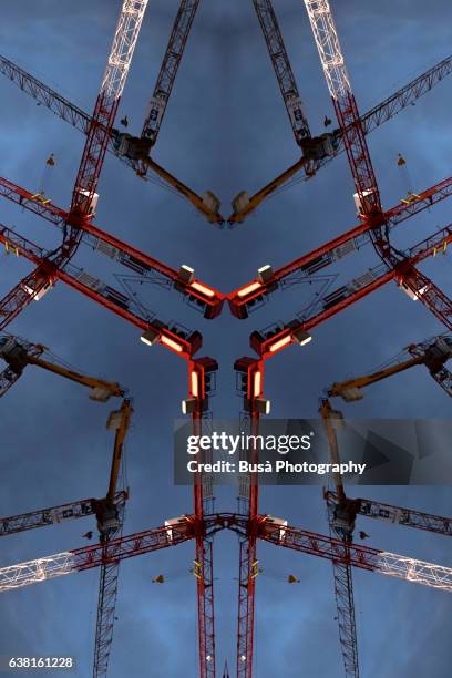 impossible architectures: digital manipulation of image of construction cranes against the sky. berlin, germany - demolition site stock illustrations