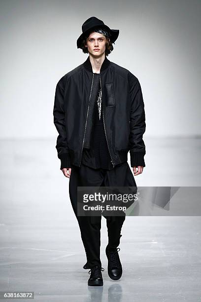 Model walks the runway at the SONGZIO show during London Fashion Week Men's January 2017 collections at BFC Show Space on January 9, 2017 in London,...