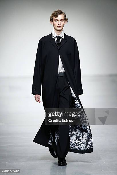 Model walks the runway at the SONGZIO show during London Fashion Week Men's January 2017 collections at BFC Show Space on January 9, 2017 in London,...