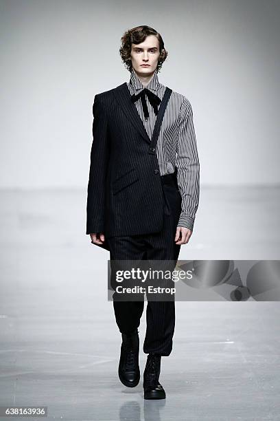 Model walks the runway at the SONGZIO show during London Fashion Week Men's January 2017 collections at BFC Show Space on January 9, 2017 in London,...