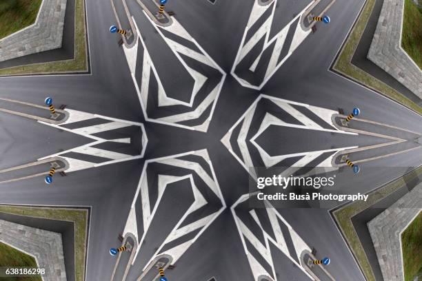 impossible space: digital manipulation of aerial view of a road with road markings in st. mortiz, switzerland - escher stock pictures, royalty-free photos & images