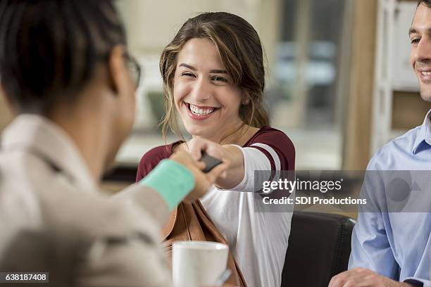 high school principal hands phone back to female student - giving a girl head stock pictures, royalty-free photos & images