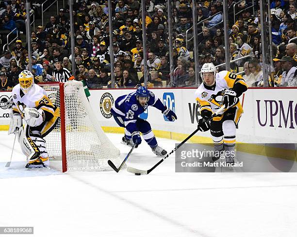Steven Oleksy of the Pittsburgh Penguins passes the puck against the Tampa Bay Lightning at PPG PAINTS Arena on January 8, 2017 in Pittsburgh,...