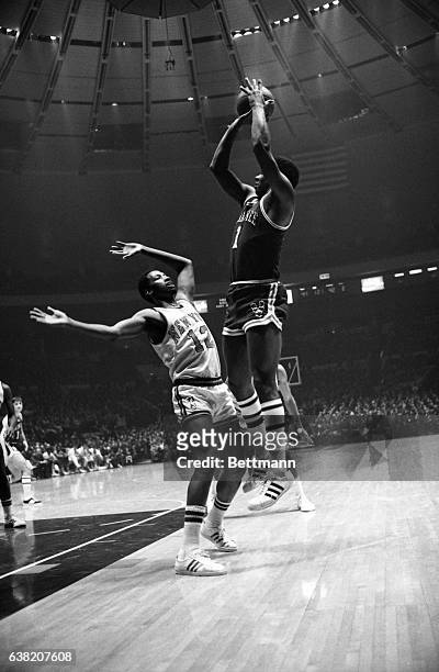 Oscar Robertson of Milwaukee in action with Dick Barnett of N.Y. Knicks.