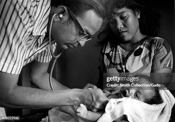 Medical team conducting annual medical examinations of Marshallese people who were exposed to radioactive fallout from an atmospheric nuclear weapons...