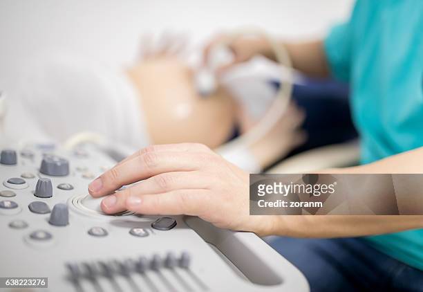 doctor using ultrasound machine - gynaecologist stock pictures, royalty-free photos & images