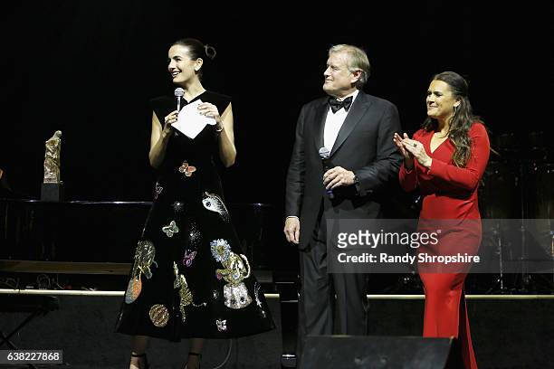 Honoree Camilla Belle accepts the Spirit of Elysium Award from chairman of the board, The Art of Elysium Tim Headington and founder of the Art of...