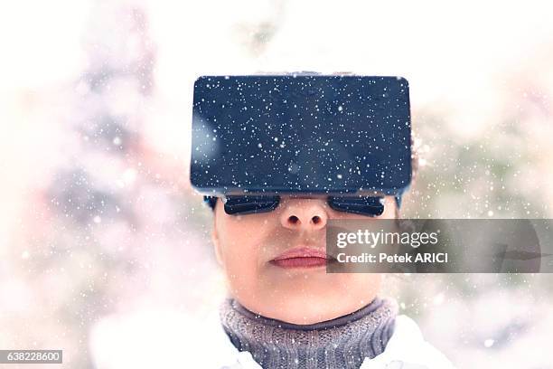 woman using a virtual reality glasses on winter - hands free apparaat stockfoto's en -beelden