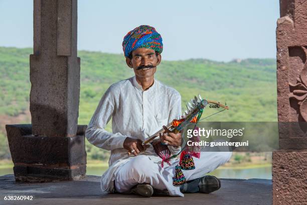 traditional musician  from rajasthan, india - folk musician stock pictures, royalty-free photos & images