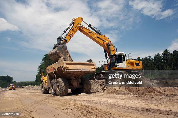 Contractor Loading 365 Contractor Loading Truck Stock Photos, High-Res Pictures, and ...