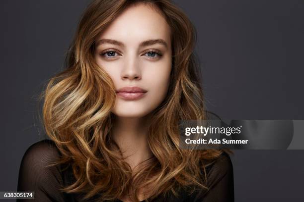 studio shot of a beautiful young woman - wavy brown hair stock pictures, royalty-free photos & images