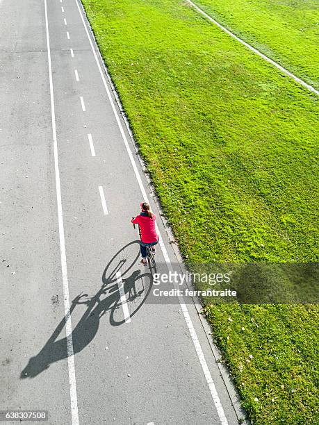 independent woman cycling - commuters overhead view stock pictures, royalty-free photos & images