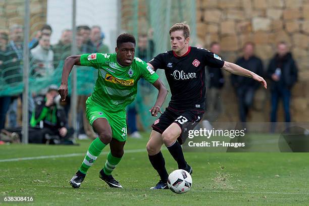 Tsiy William Ndenge of Moenchengladbach und Patrick Weihrauch of Wuerzburger Kicker battle for the ball during the friendly match between Borussia...