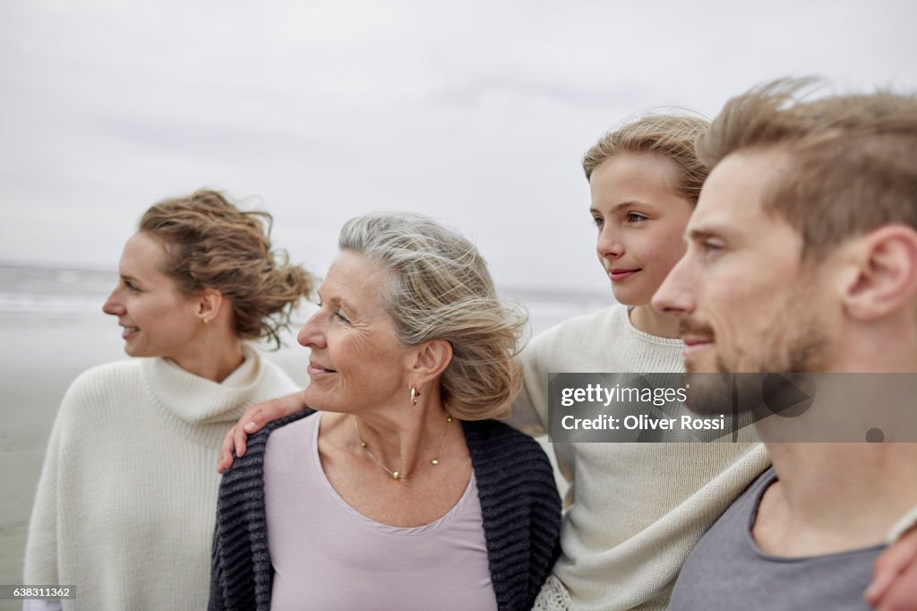 Three-generation family on the beach