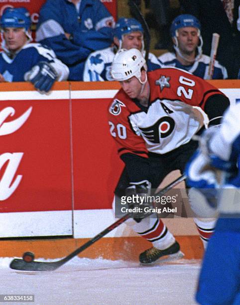 Kevin Dineen of the Philadelphia Flyers controls the puck against the Toronto Maple Leafs during game action on January 25, 1992 at Maple Leaf...