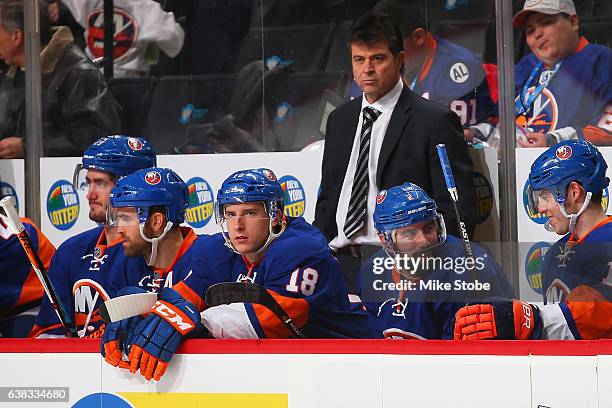 Jack Capuano of the New York Islanders looks on from the bench during the game against the Buffalo Sabres at the Barclays Center on December 23, 2016...