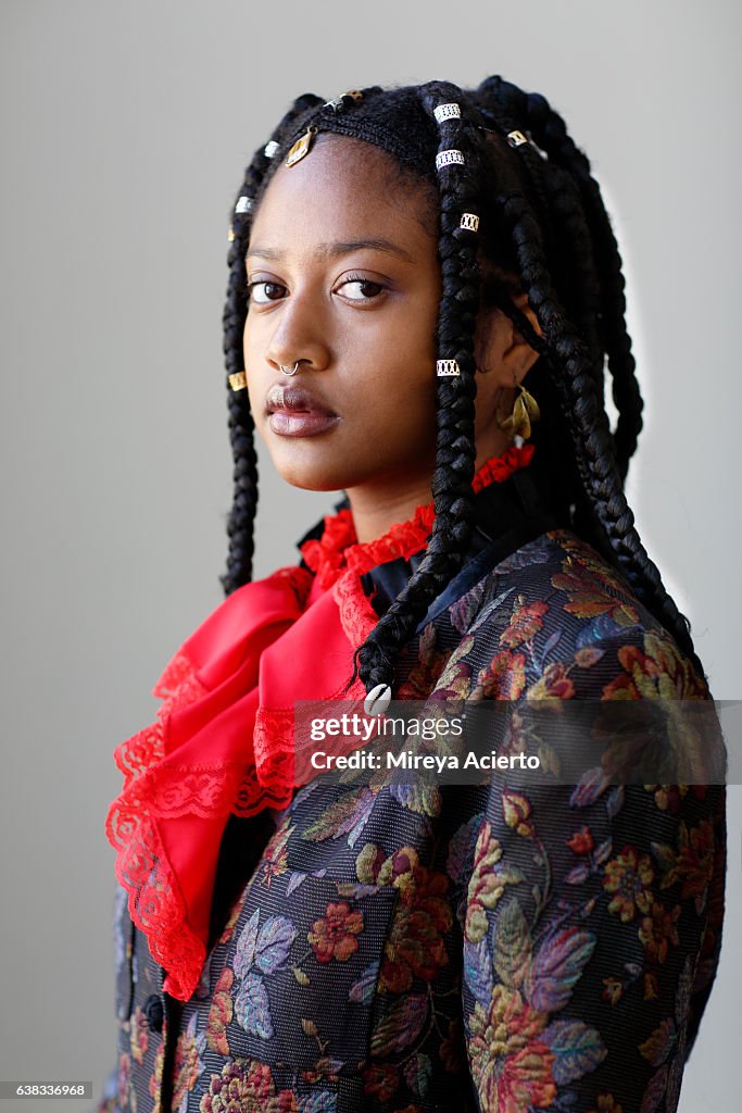Hip, fashionable, African American model with braids