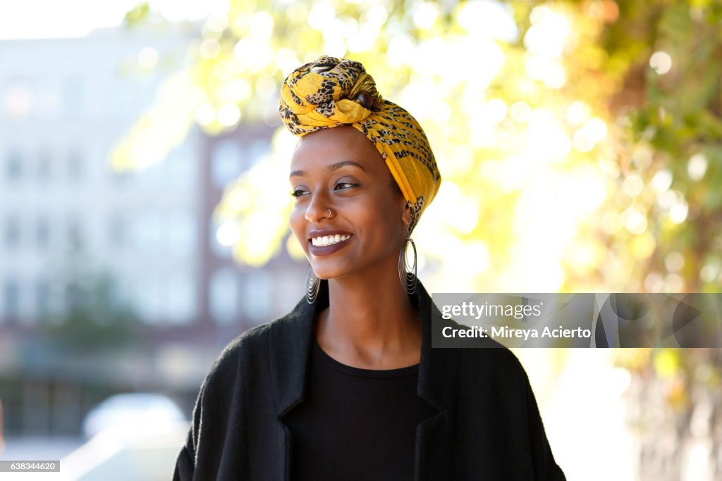 Beautiful, young, happy Muslim woman in urban setting