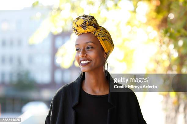 beautiful, young, happy muslim woman in urban setting - african ethnicity stock pictures, royalty-free photos & images