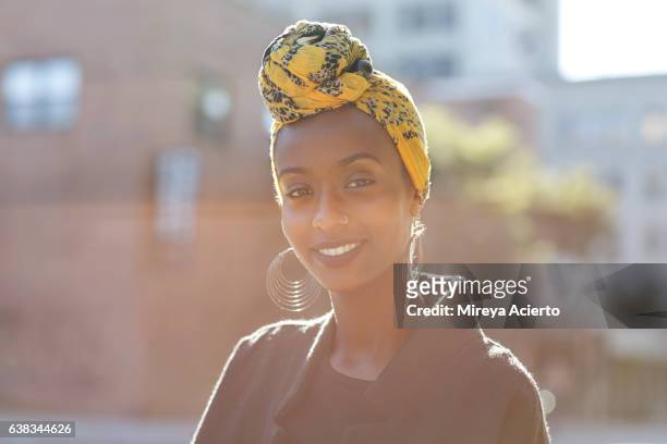 beautiful, young, happy muslim woman in urban setting - afroamerikansk kultur bildbanksfoton och bilder