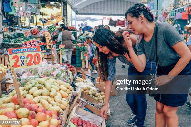 two females shopping together in market - mexico market stock pictures, royalty-free photos & images